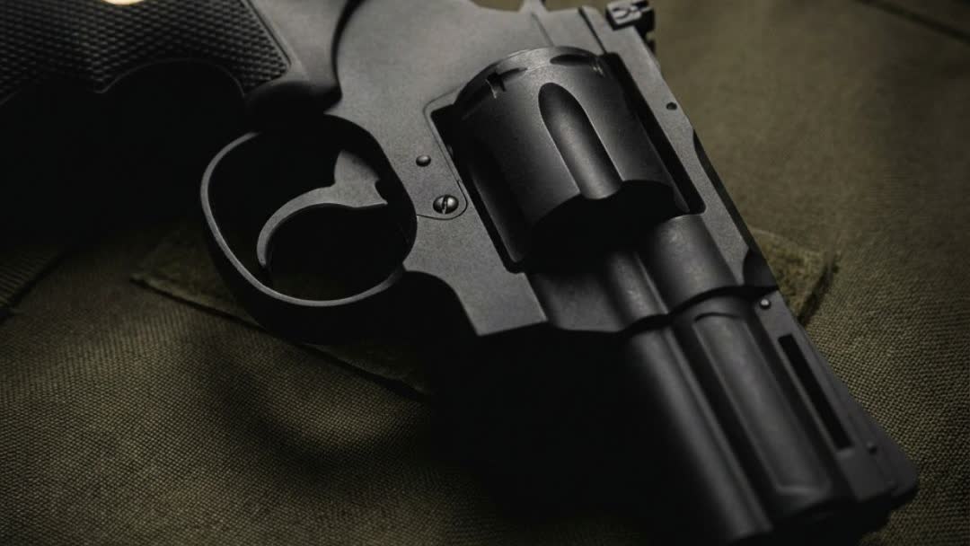Close-up of the King Arms Python .357 CO2 airsoft revolver on a tactical mat